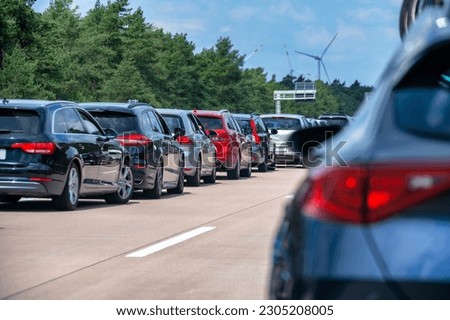 Emergency lane in a traffic jam due to full closure of the highway Royalty-Free Stock Photo #2305208005