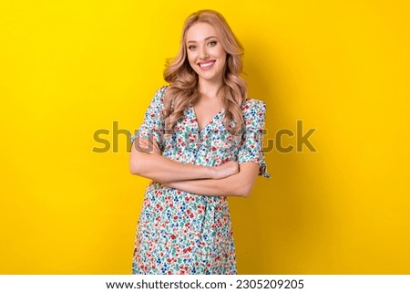 Photo of candid pretty cute lady wear bright clothes arm crossed good mood isolated on yellow color background