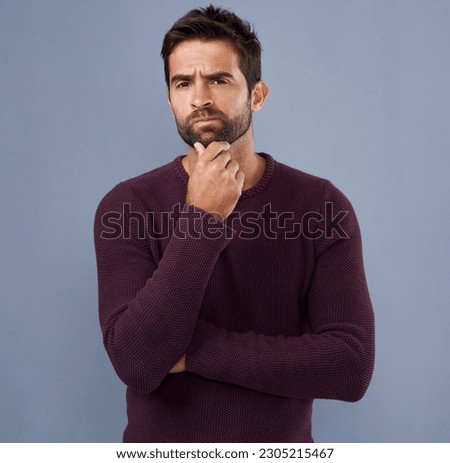 Thinking, confused and portrait of man in studio with unsure, uncertain and thoughtful on gray background. Doubt, mockup space and face of male person skeptical for decision, choice and question Royalty-Free Stock Photo #2305215467