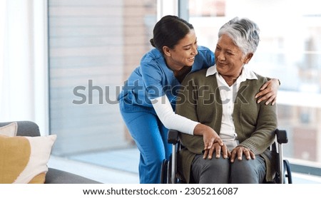 Hug, nurse with senior woman in wheelchair and talking for support. Happy, smile and communication with female nurse holding disabled senior patients hand for caregiver in nursing home consulting