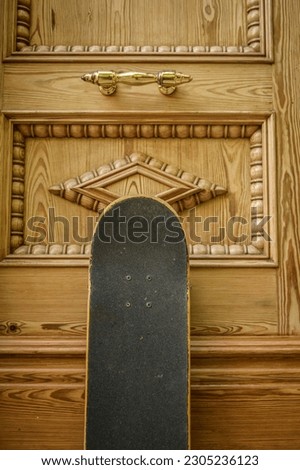 skateboard on decorated light wooden background