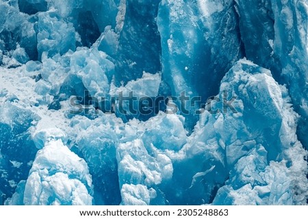 A closeup shot of the ice texture of a blue glacial wall in Inside Passage, Alaska Royalty-Free Stock Photo #2305248863