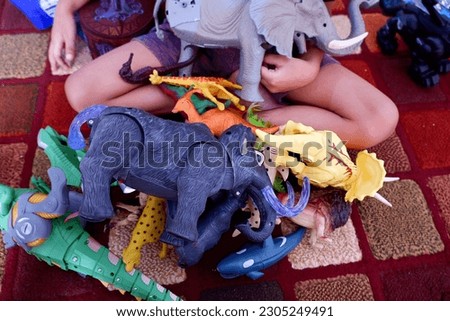 photos of various scattered children's toy animals.
