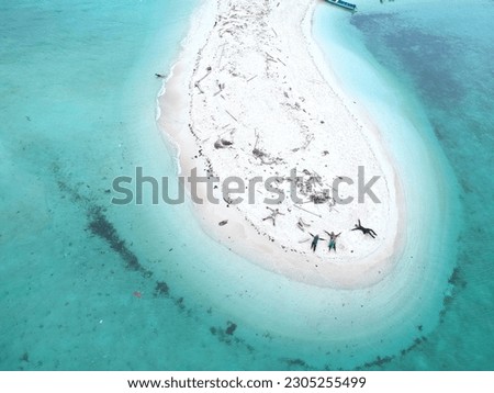 Aerial drone photo of deserted island on Maluku. The island named Pombo Island near Ambon
