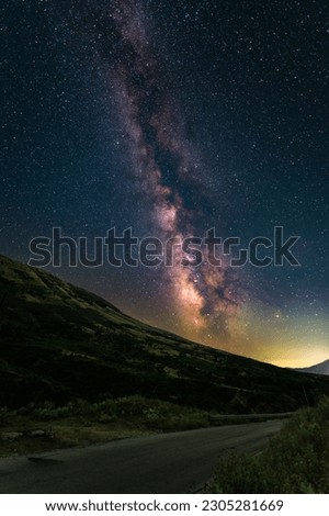 A beautiful view of the Milky Way galaxy above horizon seen from the dark skies of a road in Albania