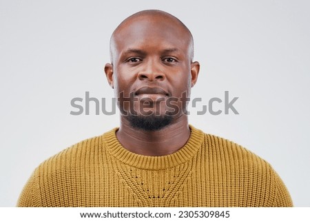 Face portrait, serious and black man in studio isolated on a white background. African, bald and male person from South Africa with fashion, style and pose with aesthetic clothes for confidence. Royalty-Free Stock Photo #2305309845
