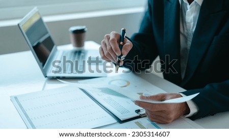 Bookkeeping financial auditing administrator asian business man making reports, calculating balance sheet. Income auditing service within audit concept, Accrued Incomes, Capital Stock, Closing Entries Royalty-Free Stock Photo #2305314607