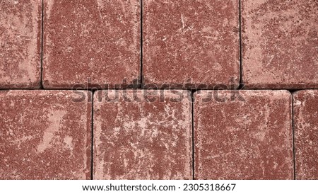 burgundy decorative paving slabs close-up.