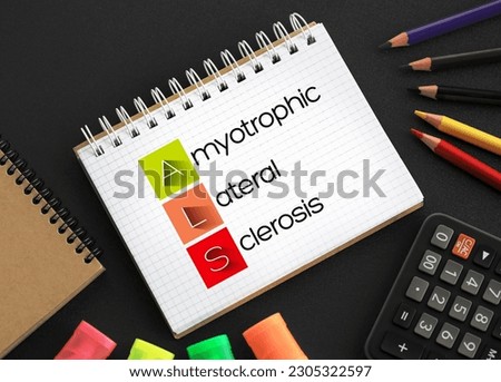 ALS - Amyotrophic Lateral Sclerosis acronym on notepad, medical concept background Royalty-Free Stock Photo #2305322597