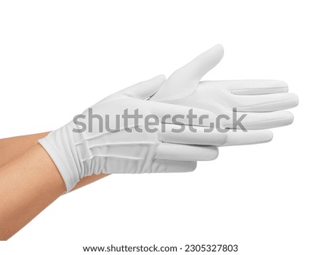 White-gloved hands rub the palms of each other. Close-up. Photo.