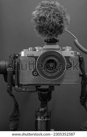 retro camera with microphone with stabilizer on dark background