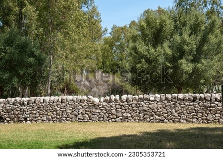 Sicilian white dry stone wall Royalty-Free Stock Photo #2305353721