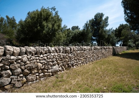 Sicilian white dry stone wall Royalty-Free Stock Photo #2305353725