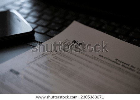 Tax Form W-9 Request for Taxpayer Identification Number and Certification, business concept. Royalty-Free Stock Photo #2305363071