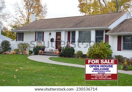 Real Estate for sale open house welcome sign on front yard suburban ranch style home residential neighborhood autumn season USA