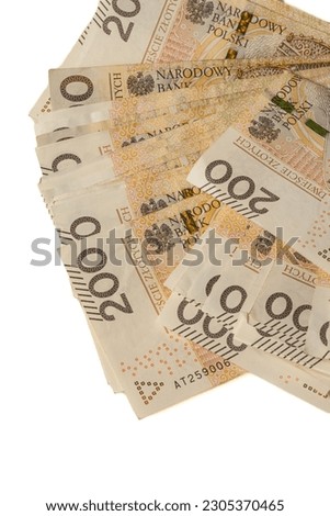 A large stack of Polish 200 zloty banknotes on a white background.  Synonymous with wealth and abundance. Royalty-Free Stock Photo #2305370465