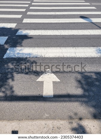 crosswalk arrow on a street