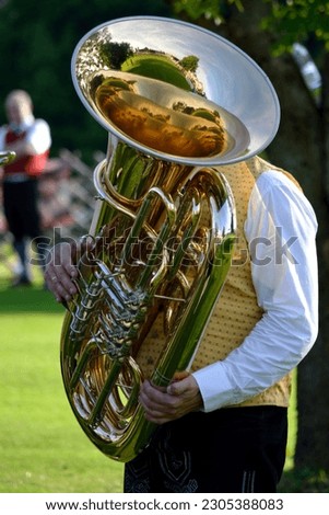 Man in costume playing the instrument Tuba Royalty-Free Stock Photo #2305388083