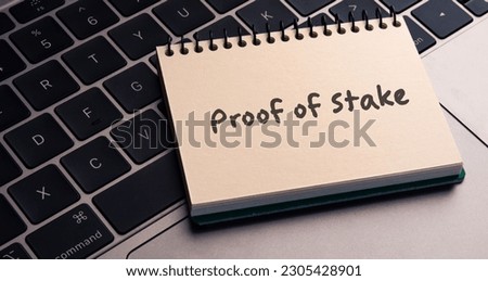 There is notebook with the word Proof of Stake.It is as an eye-catching image. Royalty-Free Stock Photo #2305428901