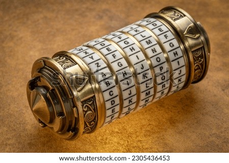 aging word as a password to combination puzzle box with rings of letters, cryptography and lifestyle concept Royalty-Free Stock Photo #2305436453