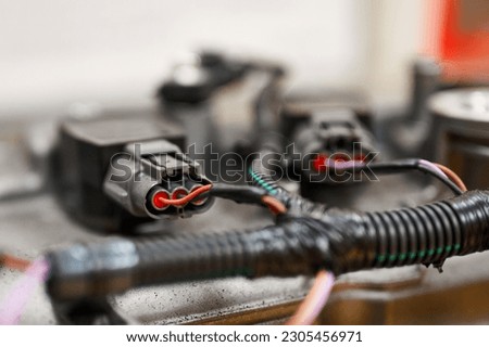 Car engine electrical cables and connectors at manufacturing Royalty-Free Stock Photo #2305456971
