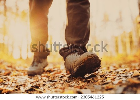 men's footsteps in the countryside in autumn  Royalty-Free Stock Photo #2305461225