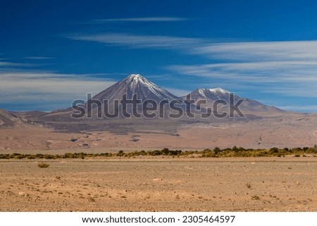 Atacama Desert, San Pedro de Atacama, Antofagasta, Chile on May 02, 2023. Moon Valley and Licancabur Volcano. Royalty-Free Stock Photo #2305464597