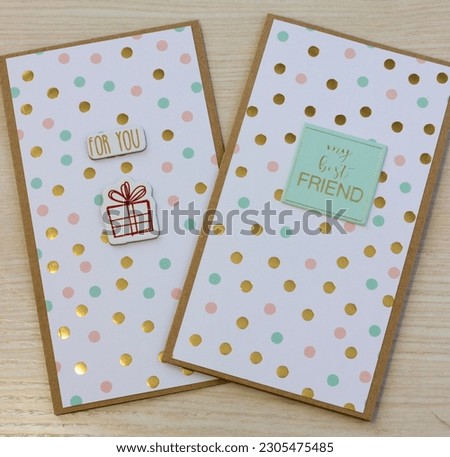 Two light postcards with multicolored small balls, with a brown outline, the inscriptions "For you" and "my best FRIEND" on a light brown wood texture background