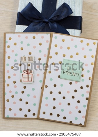 Two light postcards with multicolored small balls, with a brown outline, the inscriptions "For you" and "my best FRIEND" on a light brown wood texture background