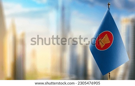 Small flags of the ASEAN on an abstract blurry background. Royalty-Free Stock Photo #2305476905
