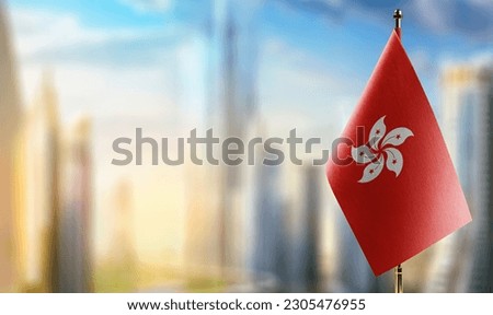 Small flags of the Hong Kong on an abstract blurry background.