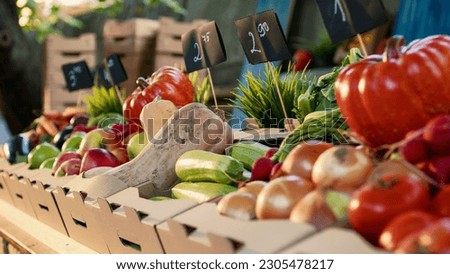 Natural locally grown products at farmers market display stand with organic agricultural farming counter. Various colorful fresh bio fruits and vegetables lying on stall at harvest festival. Royalty-Free Stock Photo #2305478217