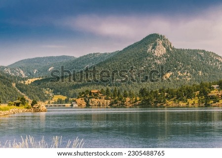 View of Estes Lake, Colorado, with mountains and dam in background