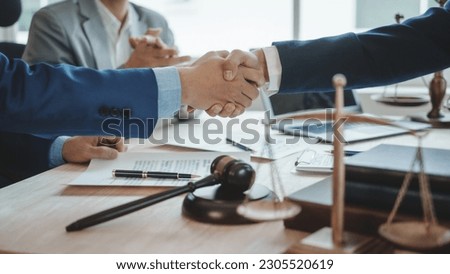 Shaking hands, Business lawyer team. Working together judge counselor having team meeting with client discussing legal legislation at law firm, Law and Legal services concept.