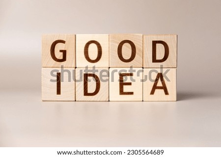The word GOOD IDEA on wooden cubes on a beige neutral studio background. Copy Space. Written. Text words matter. Conceptual Photo. Career symbol. The concept of volume increase make business grow.
