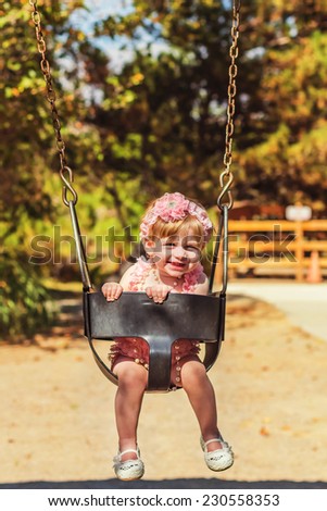 Young girl celebrating her first birthday in the park -- image taken at San Rafael Park in Reno, Nevada, USA