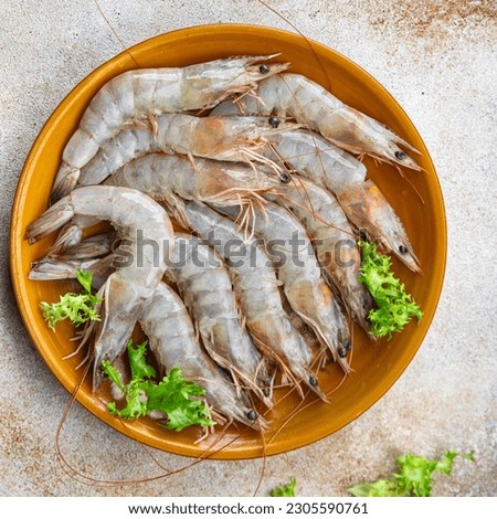 raw shrimp gambas prawn seafood meal food snack on the table copy space food background rustic top view Royalty-Free Stock Photo #2305590761