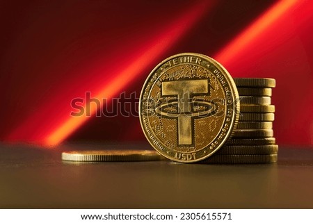 Various golden cryptocurrencies highlighting Tether coin with red textured background Royalty-Free Stock Photo #2305615571