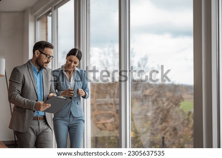Real estate agent with woman closing a deal and signing a contract.Successful lawyer giving consultation to woman about buying house.