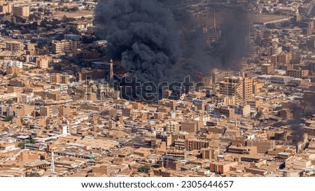 ‏The picture shows a huge fire in one of the ancient markets in Sudan (Amdurman market) likely due to the war between the Sudanese army and the Rapid Support Forces. Royalty-Free Stock Photo #2305644657