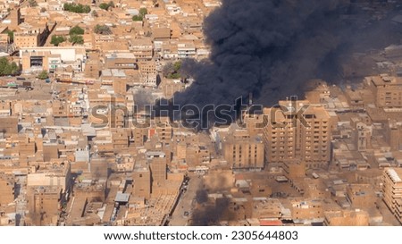 ‏The picture shows a huge fire in one of the ancient markets in Sudan (Amdurman market) likely due to the war between the Sudanese army and the Rapid Support Forces. Royalty-Free Stock Photo #2305644803
