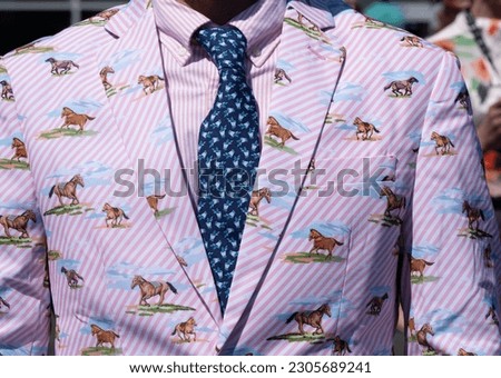 Men's fashion at a horse race Royalty-Free Stock Photo #2305689241