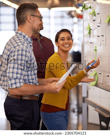 Brainstorm, smile and team on whiteboard or employees or presentation for male and female coach in office. Lady trainer, man workers and Flipchart or project for business or meeting and workplace Royalty-Free Stock Photo #2305704121