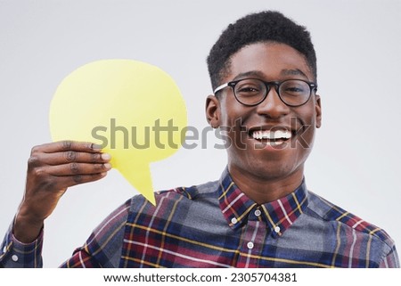 Happy black man, portrait and speech bubble for social media, question or FAQ against a white studio background. Excited African male person with smile or sign in comment, message or mockup space