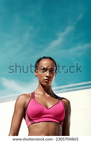 Gym, fitness and woman with focus, mockup with sky and outdoor sport for health, wellness and power. Workout, exercise and serious athlete on vertical space, target and healthy mindset for fit goals. Royalty-Free Stock Photo #2305704865
