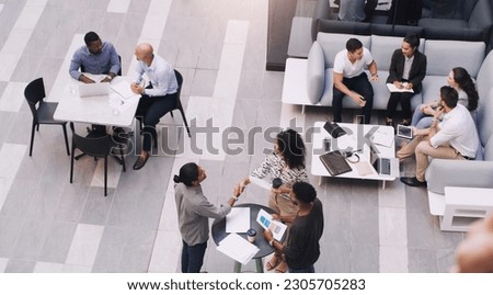 Top view, businesspeople talking and meeting at a conference at their office space. Diversity at work, communication or collaboration and networking or event planning have a conversation together Royalty-Free Stock Photo #2305705283