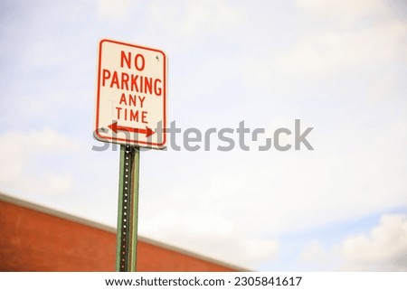 'No Parking' sign. Symbolizing rules, compliance, and maintaining order in public spaces. Order and restriction conveyed through sign