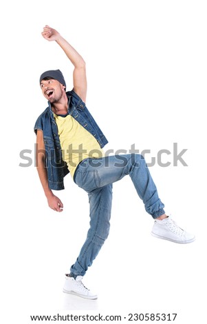 Portrait of young happy stylish dancer hip hop on the grey background.