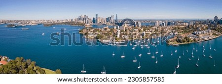 Panoramic aerial drone view of Sydney City and Sydney Harbour, NSW Australia looking over Kirribilli on a sunny morning 