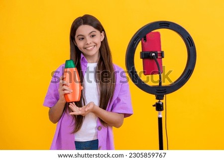 cheerful teen girl beauty blogger on background. photo of teen girl beauty blogger